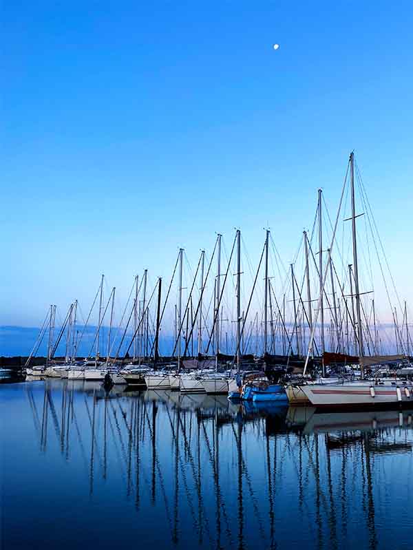 Marina of Lido di Ostia with boats lined up on the water