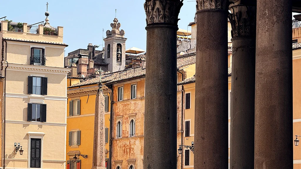 close up view of columns of pantheon facing piazza della rotonda