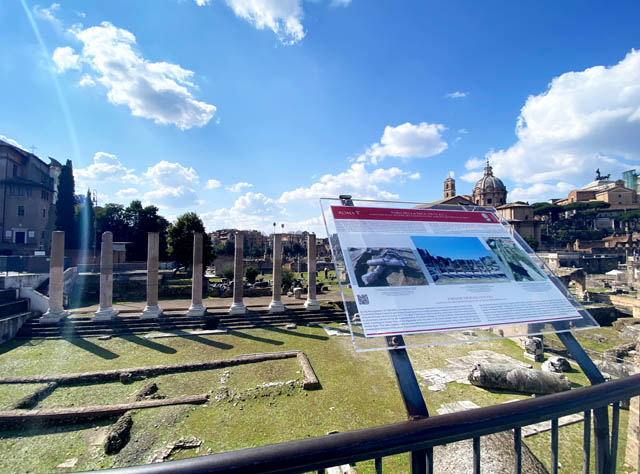 View of the Forum of Peace with an information board on the Via dei Fori Imperali in Rome Italy