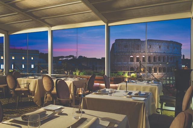 view of the Colosseum at dusk from aroma restaurant