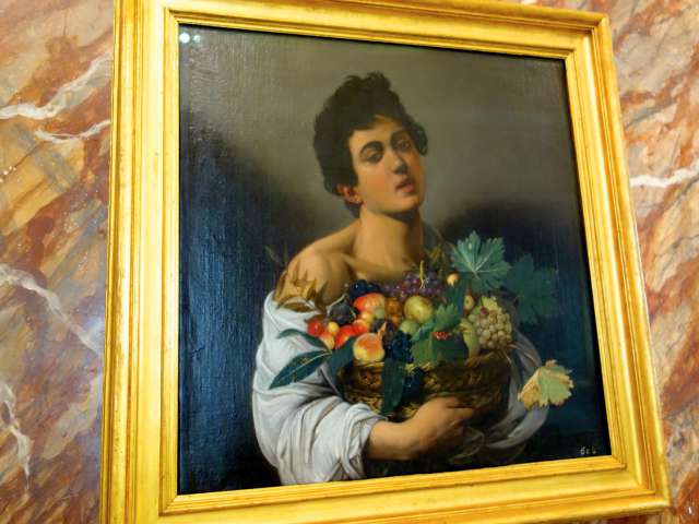 caravaggio boy with basket painting