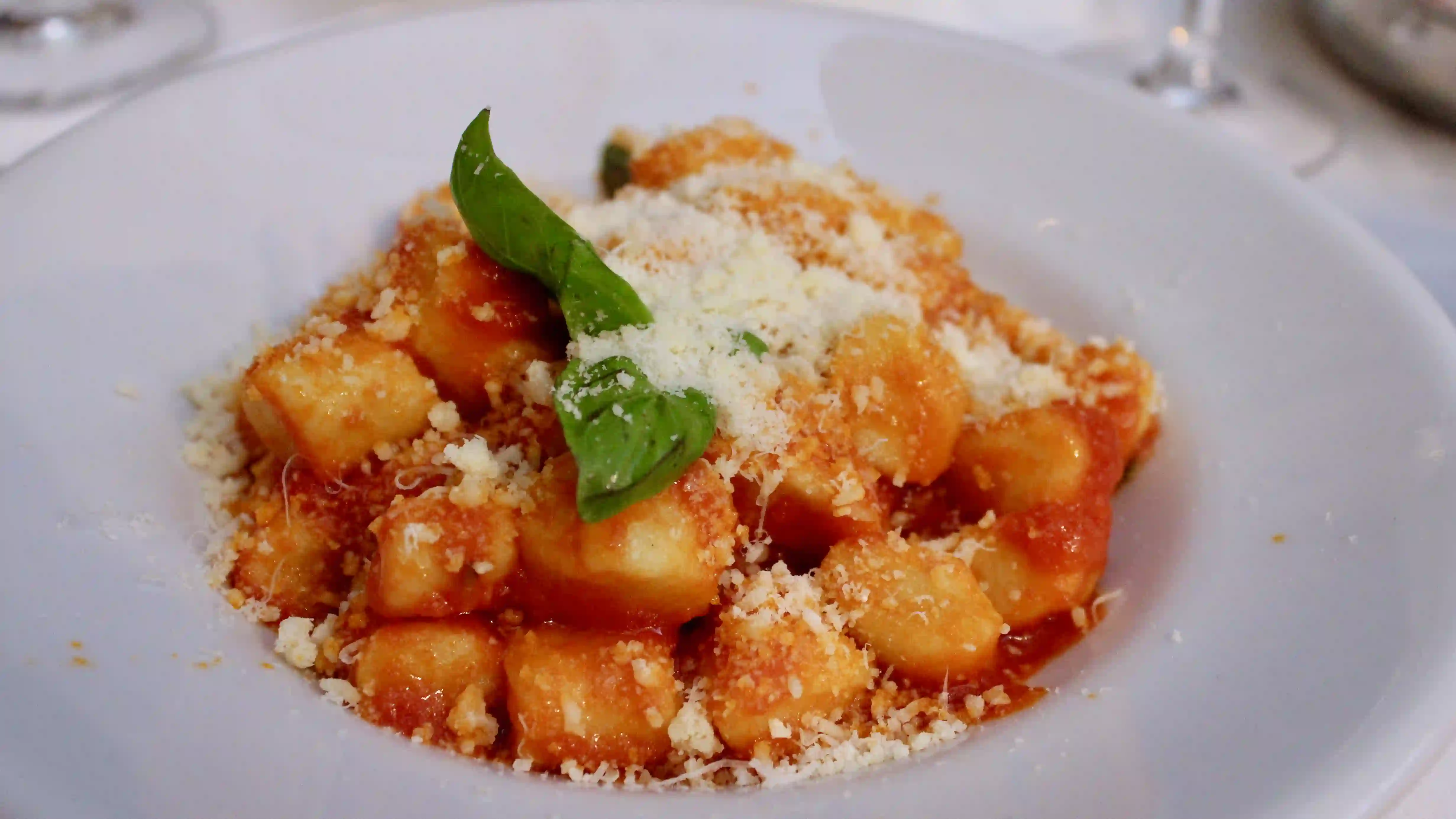 Gnocchi with tomato sauce and parmesan cheese cavalier gino - gnocchi