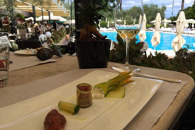 Enjoy a shaded lunch by the pool at the Roma Cavalieri Waldorf Astoria in august, enjoy a shaded lunch by the pool at l'uliveto at cavalieri waldorf astoria in rome