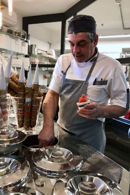 serving the gelato out of steel bins serving the gelato out of steel bins