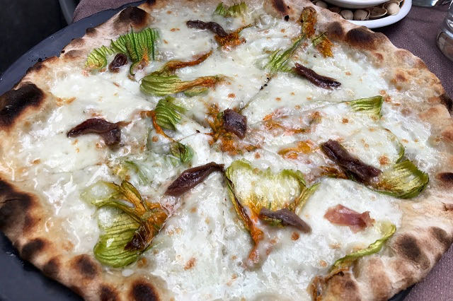 Ciampini restaurant. Pizza with zucchini flowers anchovies and mozzarella Ciampini restaurant. Pizza with zucchini flowers anchovies and mozzarella