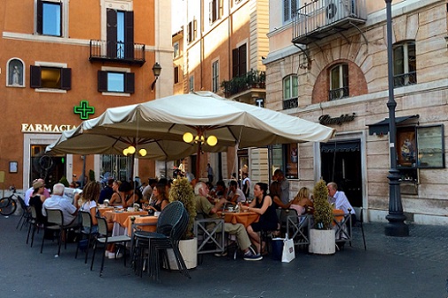sitting outside at Ciampini in rome in august