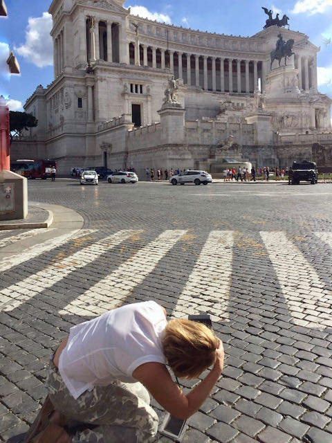 getting low to get a shot of the Vittoriano monument shooting the vittoriano monument