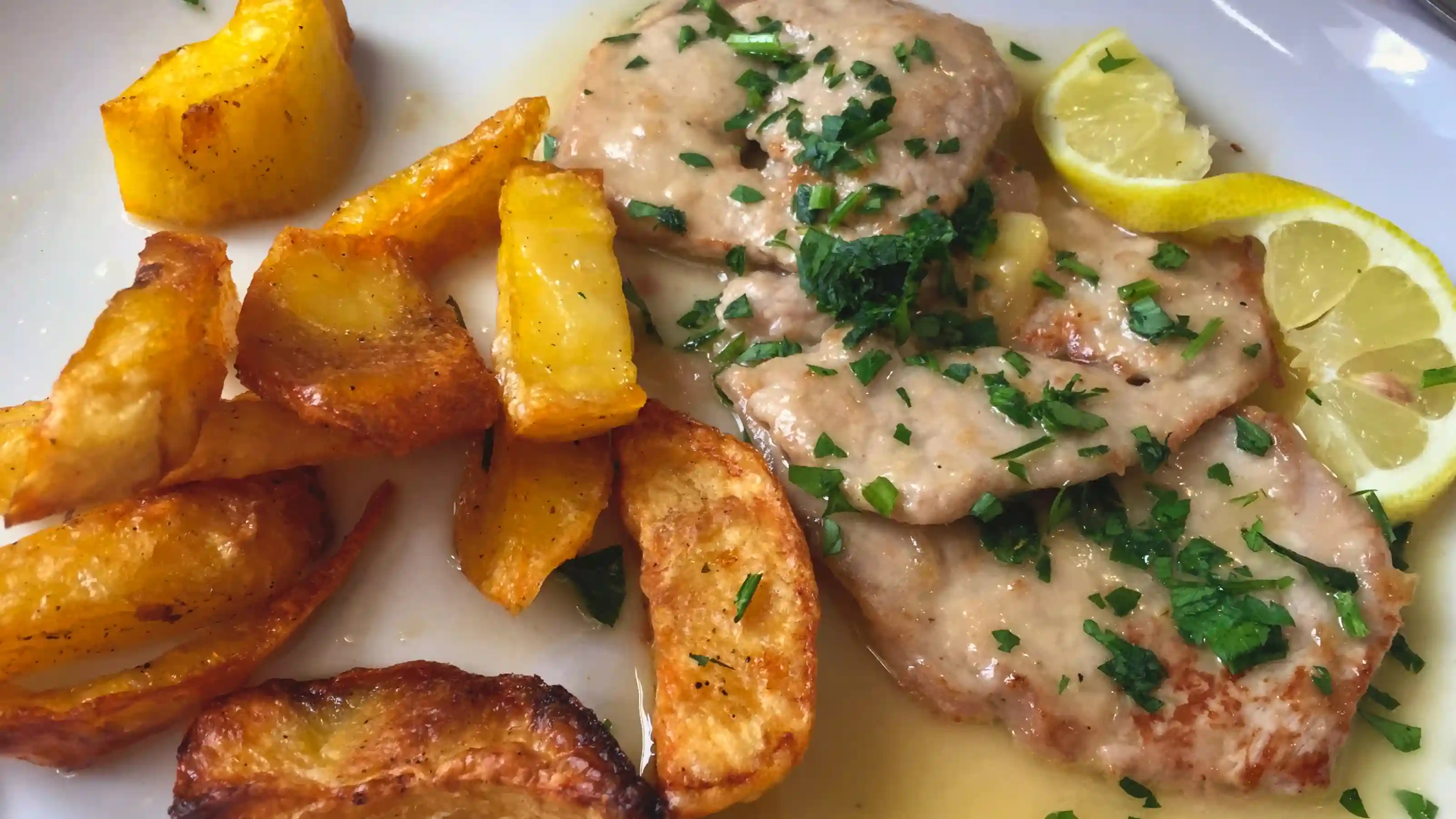 Veal piccata with potatoes at Hostaria Romana hostaria romana - veal piccata with potatoes