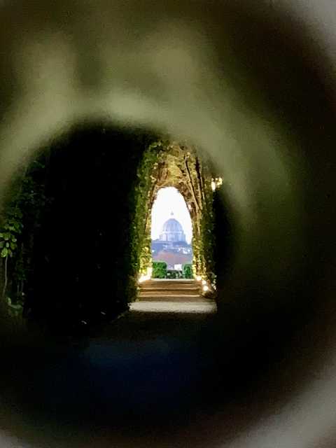 view of st peter's basilica through the Knights of Malta keyhole view of st peter's basilica through the Knights of Malta keyhole