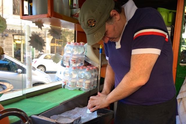 scraping ice for grattachecca