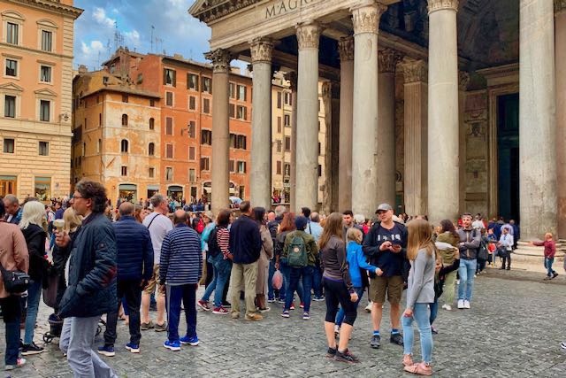 people near the Pantheon in spring pantheon with people around it