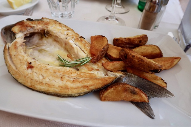 Grilled fish and potatoes at La Scala restaurant Grilled fish and potatoes at La Scala restaurant
