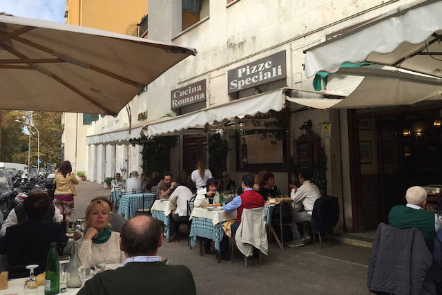 eating outside at romolo e remo restaurant in rome