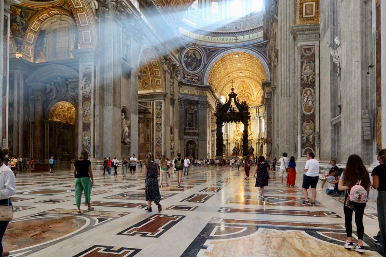 saint peter's basilica inside with rays of light
