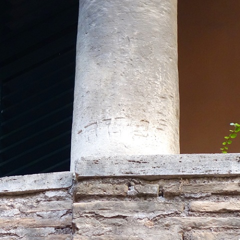 closeup of column of synagogue with hebrew writing