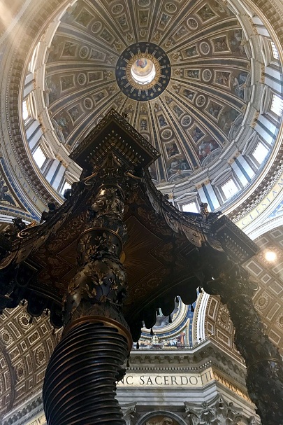 michelangelo's dome and bernini's baldachin in st peters basilica