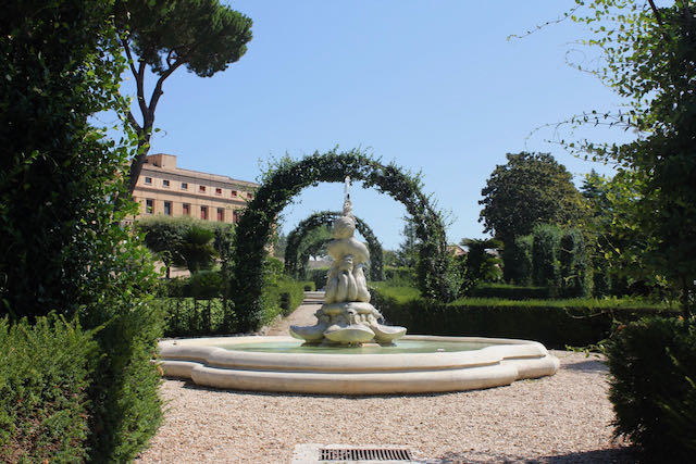 trellis and fountain in gardens at vatican