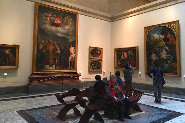 sitting in the Pinacoteca in vatican museums