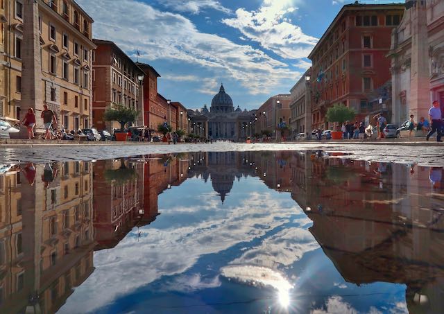 vatican reflected in a puddle after the rain vatican reflection in rain puddle